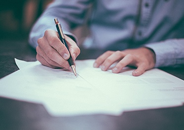Man signing a contract