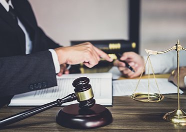 Two men looking at the documents on the table